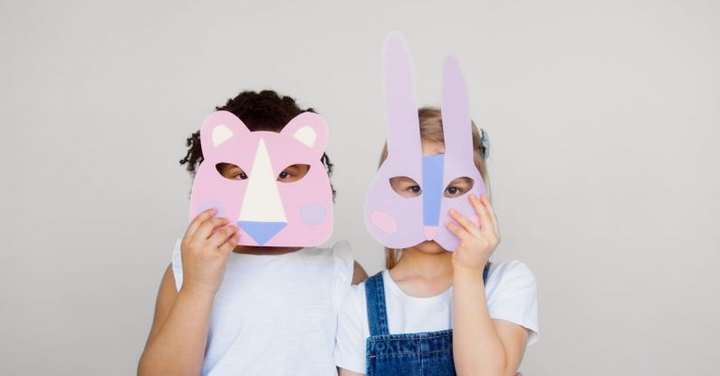 Innovative Mindset - Two Kids Covering Their Faces With a Cutout Animal Mask