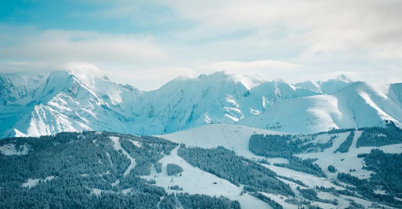 Stress Reduction - A view of a snowy mountain range with a ski slope