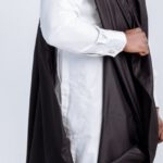 Cultural Intelligence - Elegant Man with Eyeglasses in Black Gown and White Shirt