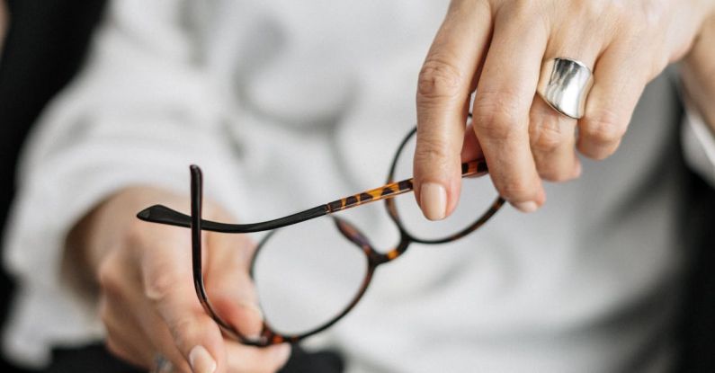 Cultural Consultation - Person Holding Brown Framed Eyeglasses