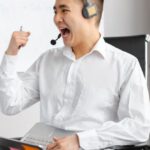 Emotion Customer Loyalty - Man in White Dress Shirt Wearing Headphones