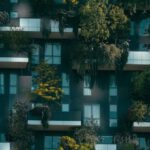 Building Community - Modern residential building facade decorated with green plants