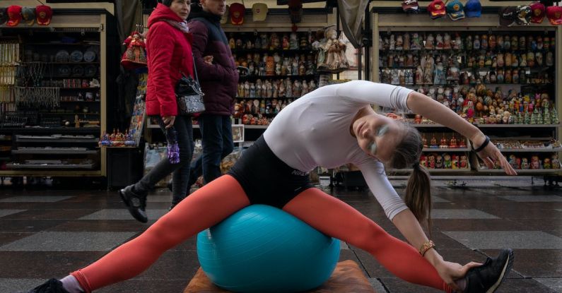 Market Fit - Woman Sitting on Blue Exercise Ball