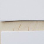 Ethics Marketing - Top view of stacks of white mockup greeting cards placed on light wooden desk in soft daylight