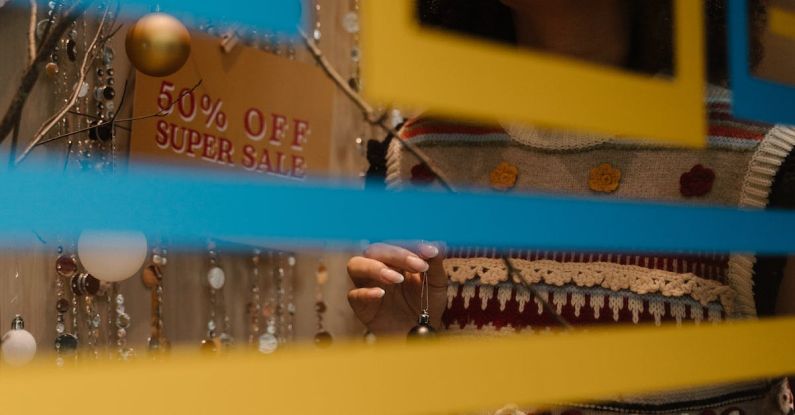 Marketing Transparency - A Woman Decorating the Store Display Window