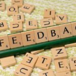 Customer Feedback - The word feedback is spelled out with scrabble tiles