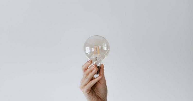 Innovation Inspiration - Anonymous female showing light bulb